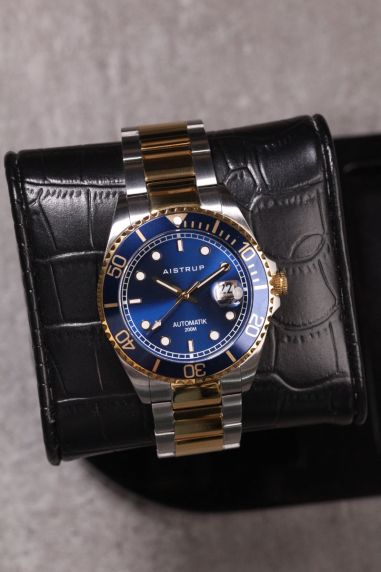 Elegant automatic diver's watch with blue dial, matching blue bezel, and two-tone steel and gold bracelet for the discerning man | AIW8305